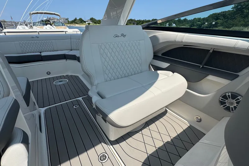 Slide: The Image of Luxurious interior of 2025 Sea Ray SLX 310 Outboard with elegant seating and modern design. - 41