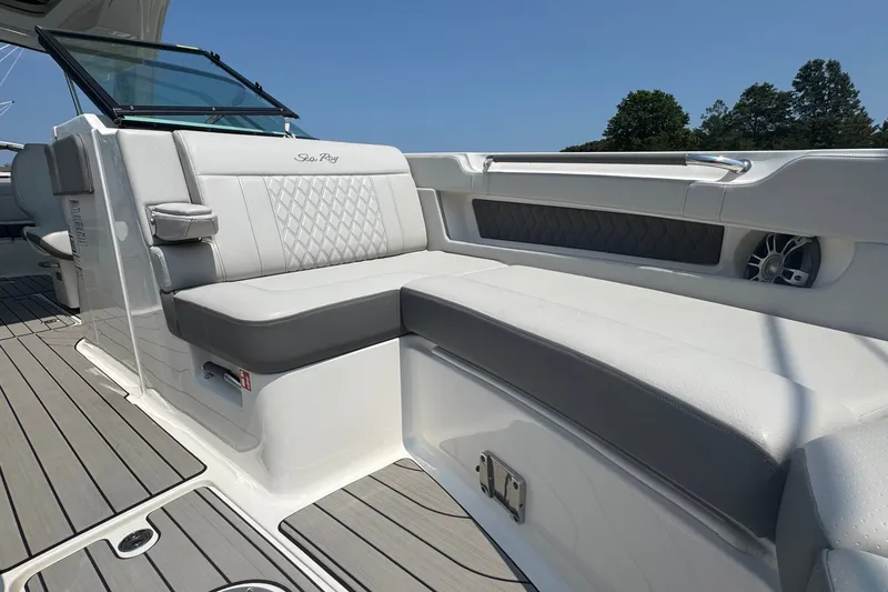 Slide: The Image of 2025 Sea Ray SLX 310 Outboard boat interior with luxurious seating and modern design. - 49