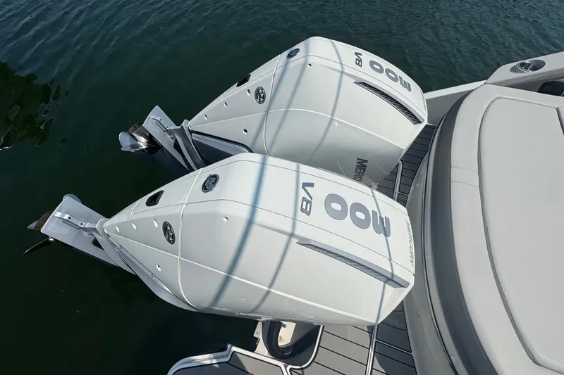 Slide: The Image of 2025 Sea Ray SLX 310 Outboard with twin Mercury 300 V8 engines on water. - 13