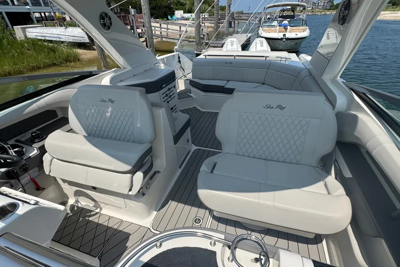 Slide: The Image of Luxurious interior of 2025 Sea Ray SLX 310 Outboard boat with elegant seating. - 39