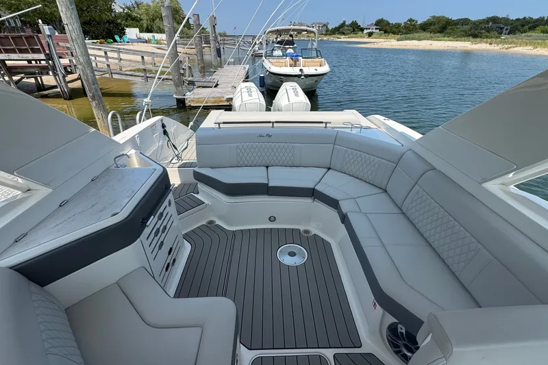 Slide: The Image of Luxurious 2025 Sea Ray SLX 310 Outboard boat interior with spacious seating and elegant design. - 20