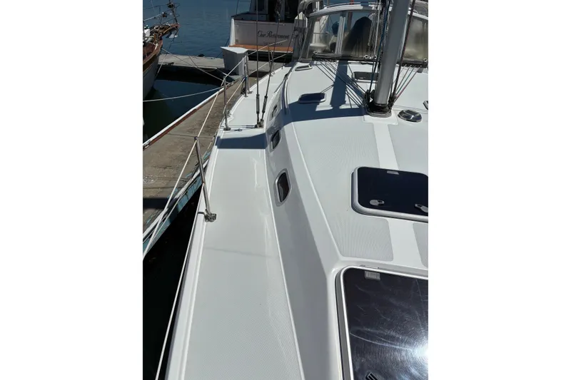 Slide: The Image of Deck view of a 2001 Catalina 42 MkII sailboat docked at a marina. - 15