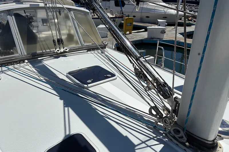 Slide: The Image of Deck of 2001 Catalina 42 MkII sailboat with rigging and hatches in marina. - 18