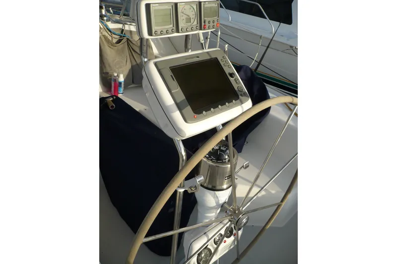 Slide: The Image of Steering wheel and navigation instruments on a 2001 Catalina 42 MkII sailboat. - 22