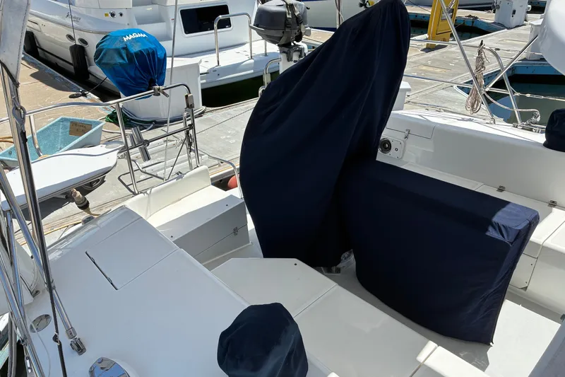 Slide: The Image of 2001 Catalina 42 MkII sailboat cockpit with covered seating at marina. - 20