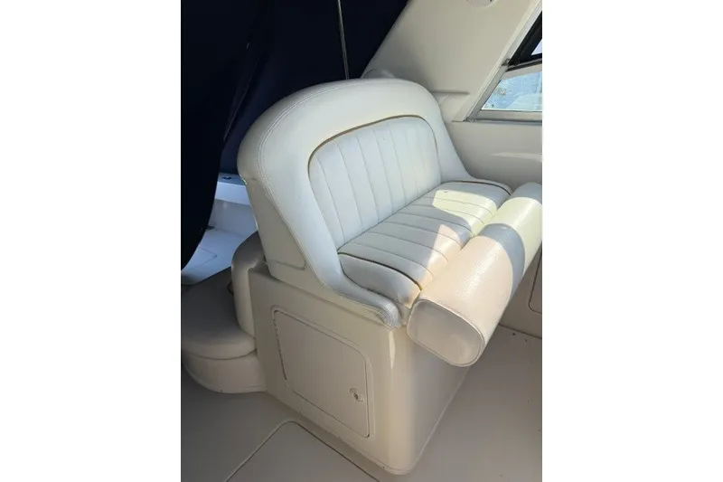 Slide: The Image of White leather seat on 1999 Sea Ray 330 Express Cruiser boat. - 4
