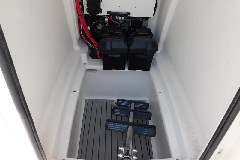 Slide: The Image of Interior view of 2026 Pair Customs 24 Center Console DV Offshore boat compartment. - 40