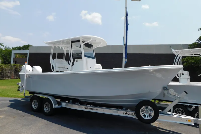 The Image of 2026 Pair Customs 24 Center Console DV Offshore boat on trailer, ready for adventure. - 0