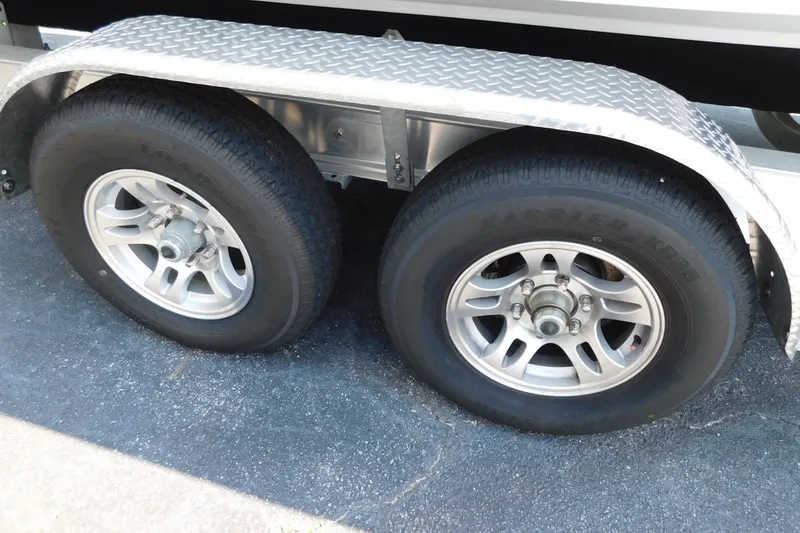 Slide: The Image of Trailer wheels of a 2026 Pair Customs 24 Center Console DV Offshore boat. - 44
