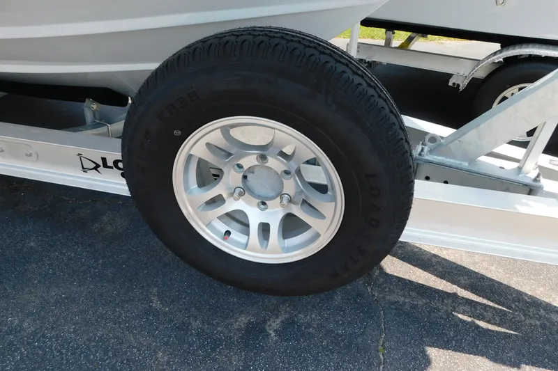 Slide: The Image of Trailer wheel of 2026 Pair Customs 24 Center Console DV Offshore boat. - 43