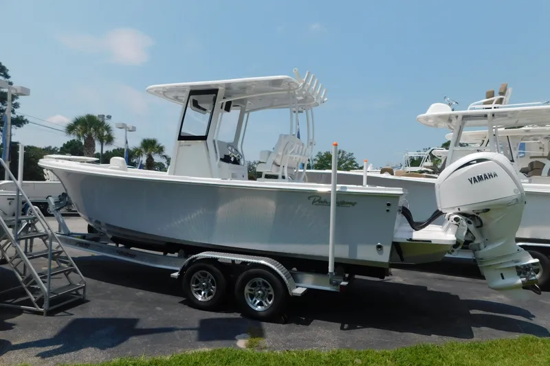 Slide: The Image of 2026 Pair Customs 24 Center Console DV Offshore boat with Yamaha engine on trailer. - 3