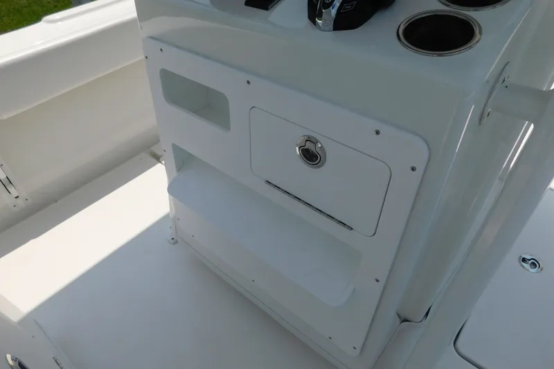 Slide: The Image of 2026 Pair Customs 24 Center Console DV Offshore boat interior with storage compartments. - 14