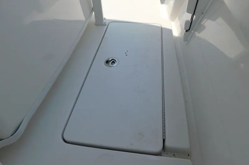 Slide: The Image of 2026 Pair Customs 24 Center Console DV Offshore boat deck with storage compartment. - 38