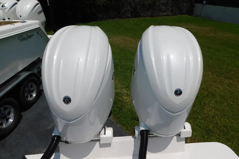Slide: The Image of Twin Yamaha outboard motors on a 2026 Pair Customs 24 Center Console DV Offshore boat. - 22