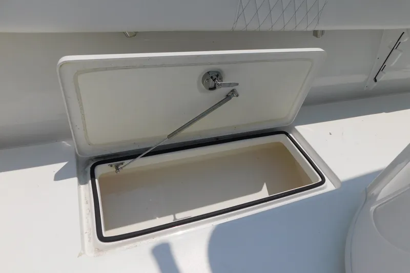Slide: The Image of Open storage compartment on 2026 Pair Customs 24 Center Console DV Offshore boat. - 20