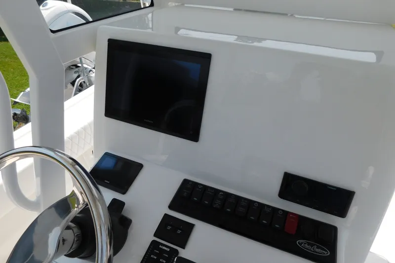 Slide: The Image of Center console dashboard of 2026 Pair Customs 24 Center Console DV Offshore boat. - 15
