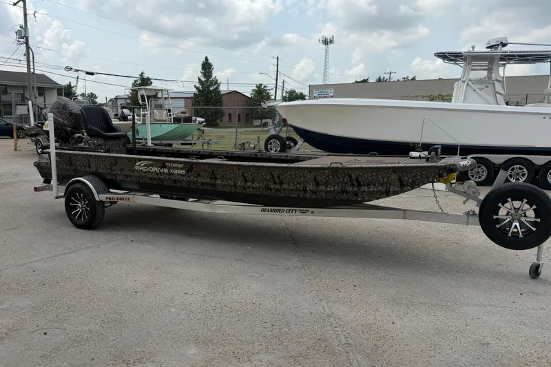 Slide: The Image of 2026 Pro-Drive 2054 X TD Stick Steer boat on trailer in outdoor setting. - 5