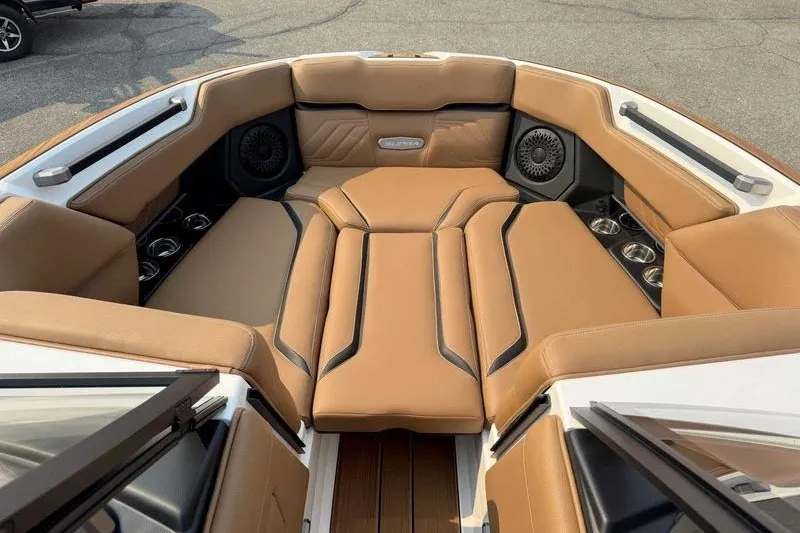 Slide: The Image of Luxurious interior of 2027 Supra SR boat with tan leather seating and speakers. - 16