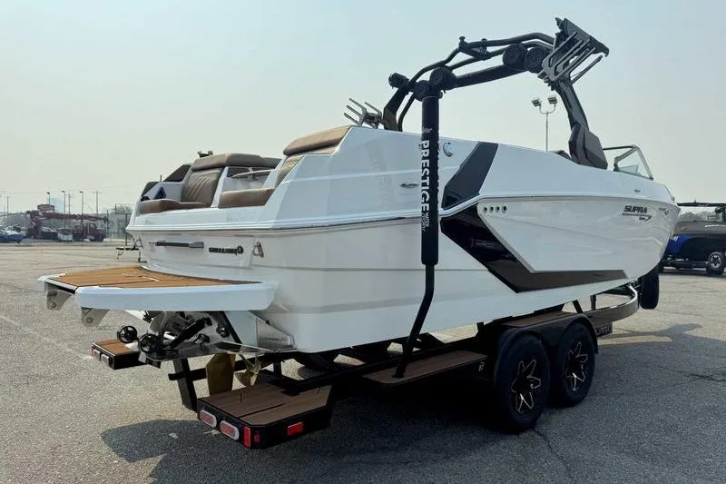 Slide: The Image of 2027 Supra SR boat on trailer, featuring sleek design and modern amenities. - 8