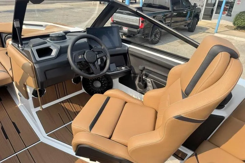 Slide: The Image of 2027 Supra SR boat interior with tan leather seats and modern dashboard. - 13