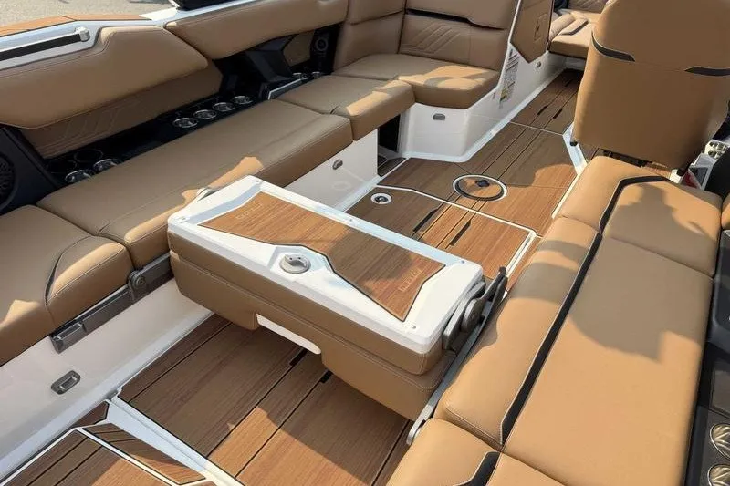 Slide: The Image of Luxurious interior of 2027 Supra SR boat with tan leather seating and wooden flooring. - 2