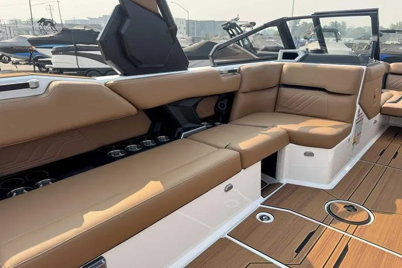 Slide: The Image of Luxurious interior of 2027 Supra SR boat with tan leather seating and sleek design. - 15