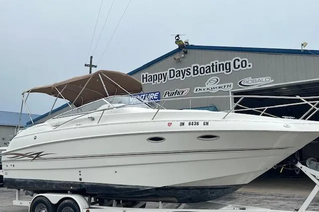 Slide: The Image of 2000 Larson Cabrio 254 boat on trailer at Happy Days Boating Co. - 2