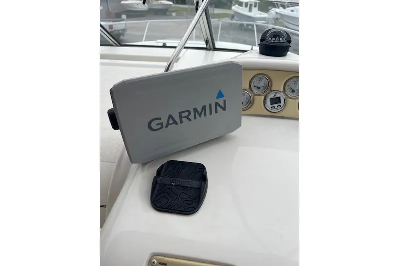 Slide: The Image of Dashboard of a 2000 Larson Cabrio 254 with Garmin navigation system. - 9