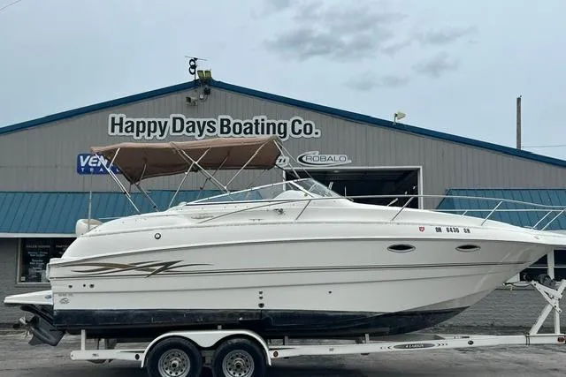 The Image of 2000 Larson Cabrio 254 boat on trailer at Happy Days Boating Co. - 0