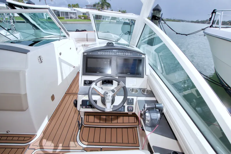 Slide: The Image of 2017 Boston Whaler 320 Vantage helm with modern controls and dual screens. - 36