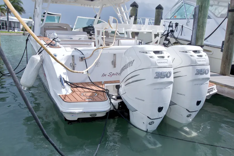 Slide: The Image of 2017 Boston Whaler 320 Vantage with twin Mercury 350 engines docked at marina. - 13
