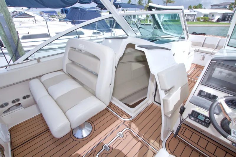 Slide: The Image of 2017 Boston Whaler 320 Vantage interior with seating and helm, showcasing luxury design. - 30