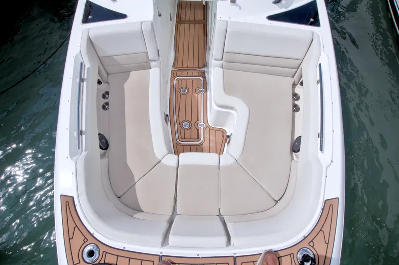 Slide: The Image of 2017 Boston Whaler 320 Vantage boat interior with cushioned seating and teak flooring. - 46