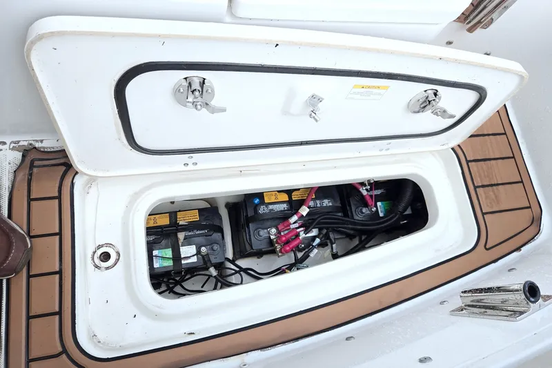 Slide: The Image of Open battery compartment of 2017 Boston Whaler 320 Vantage boat, showing wiring and connections. - 47