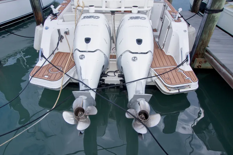 Slide: The Image of Boston Whaler 320 Vantage 2017 with twin outboard engines docked at marina. - 60
