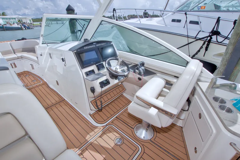 Slide: The Image of 2017 Boston Whaler 320 Vantage boat interior with modern helm and teak flooring. - 33