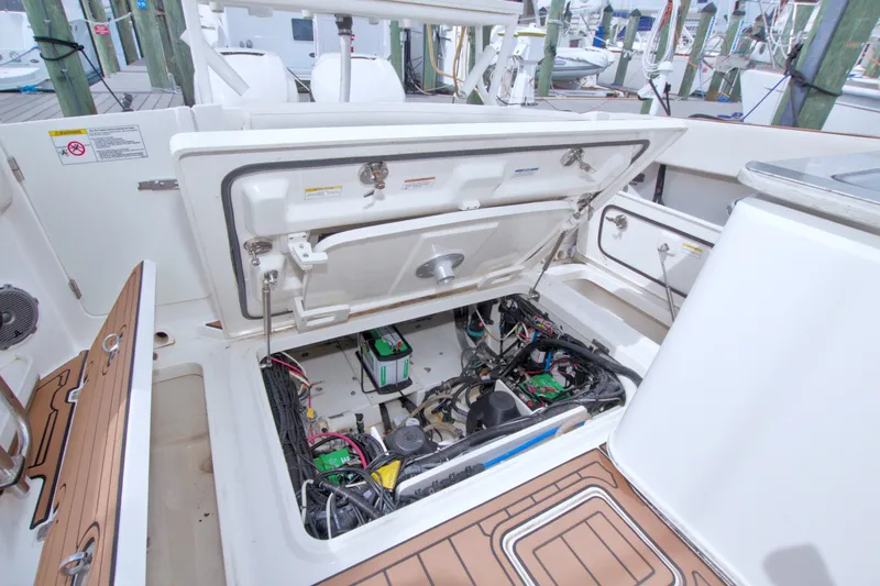 Slide: The Image of Open engine compartment of 2017 Boston Whaler 320 Vantage boat at dock. - 53