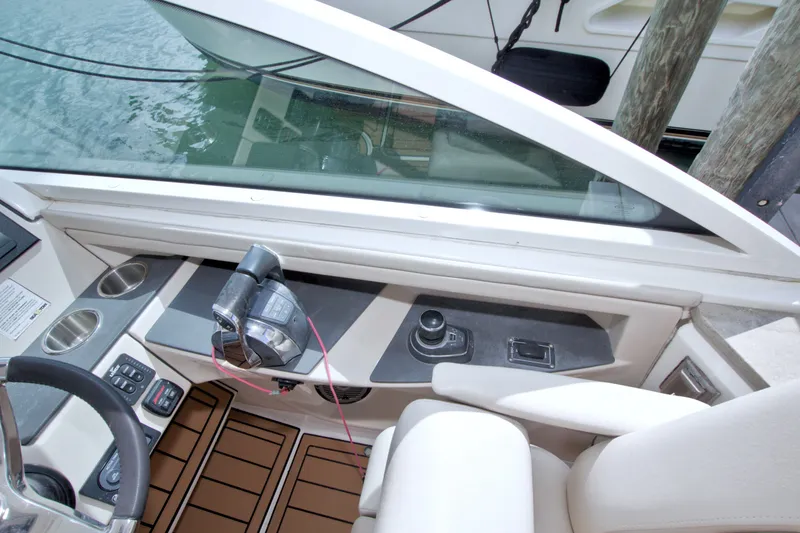 Slide: The Image of Interior view of 2017 Boston Whaler 320 Vantage boat cockpit with controls and seating. - 35