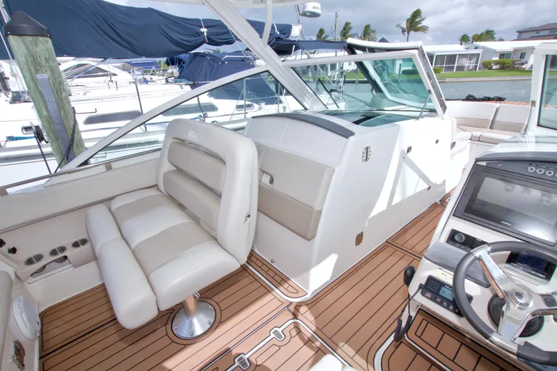 Slide: The Image of Interior of a 2017 Boston Whaler 320 Vantage boat with luxurious seating and modern controls. - 29