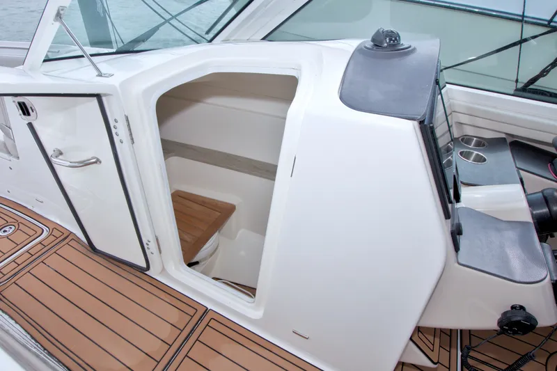 Slide: The Image of 2017 Boston Whaler 320 Vantage cabin interior with wooden flooring and seating. - 38