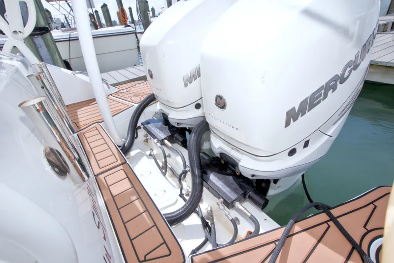 Slide: The Image of 2017 Boston Whaler 320 Vantage with twin Mercury outboard engines at dock. - 20
