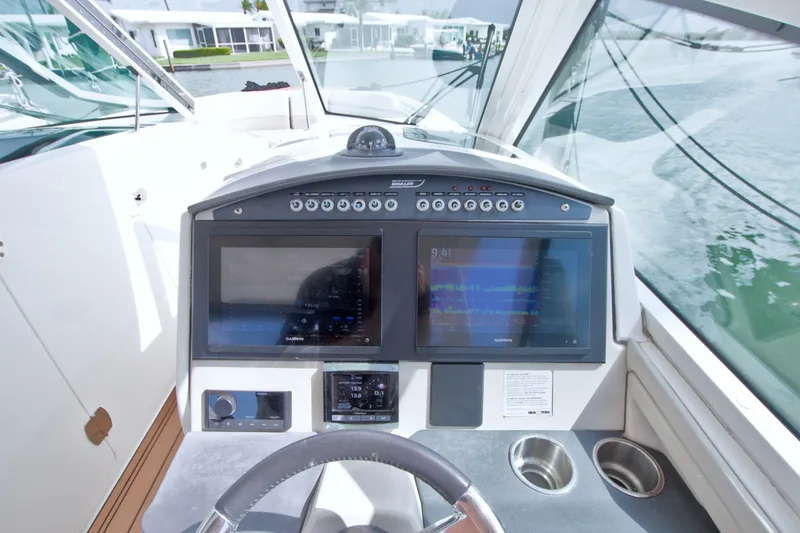 Slide: The Image of Cockpit view of 2017 Boston Whaler 320 Vantage with dual navigation screens. - 37