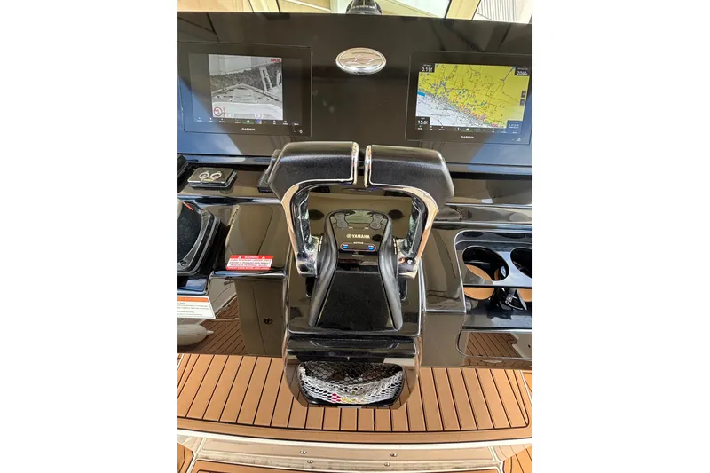 Slide: The Image of 2021 Scout 305 LXF boat dashboard with dual Garmin displays and Yamaha controls. - 36