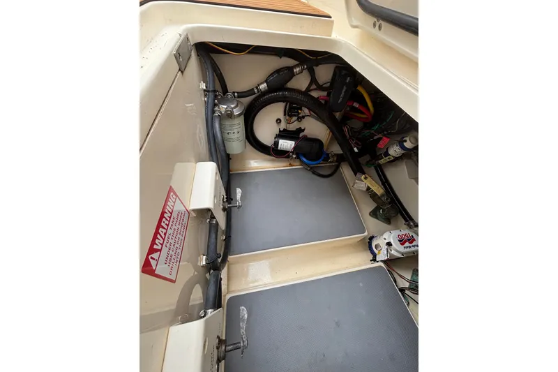 Slide: The Image of 2021 Scout 305 LXF boat interior showing wiring and mechanical components. - 44