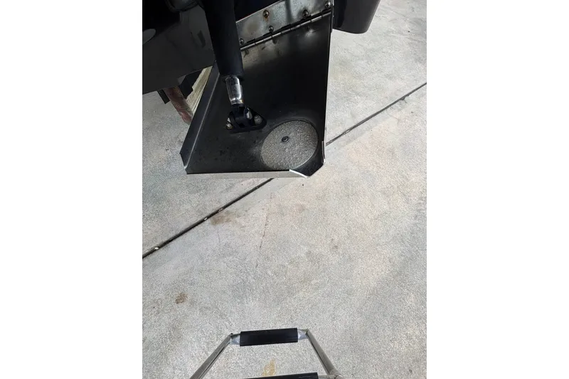 Slide: The Image of Rear view of a 2021 Scout 305 LXF boat ladder on concrete surface. - 16