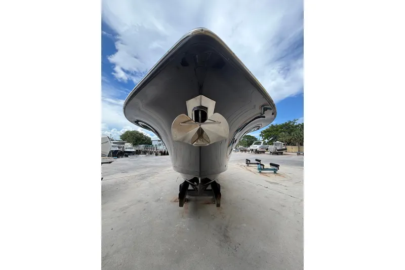 Slide: The Image of 2021 Scout 305 LXF boat on dry dock, viewed from the bow. - 14