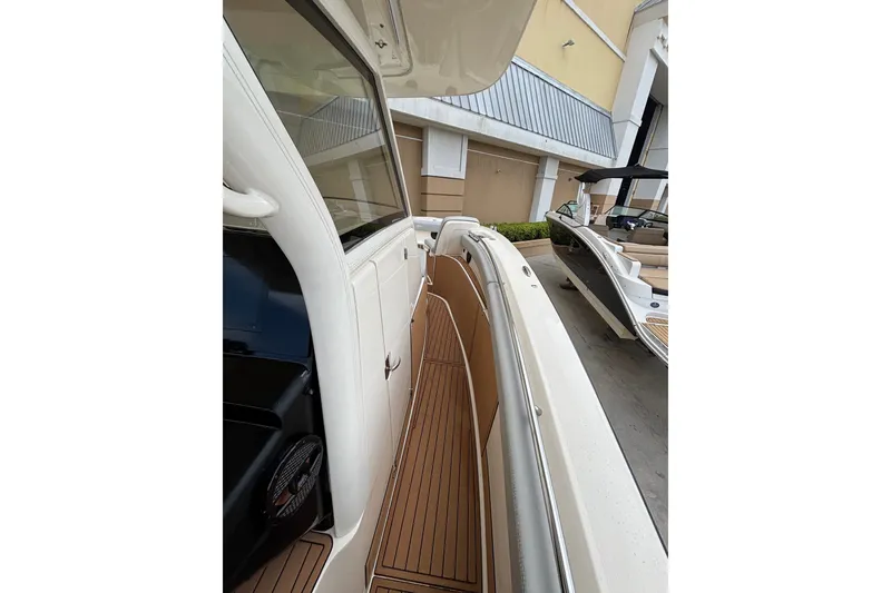 Slide: The Image of 2021 Scout 305 LXF boat with sleek deck design and modern features. - 21