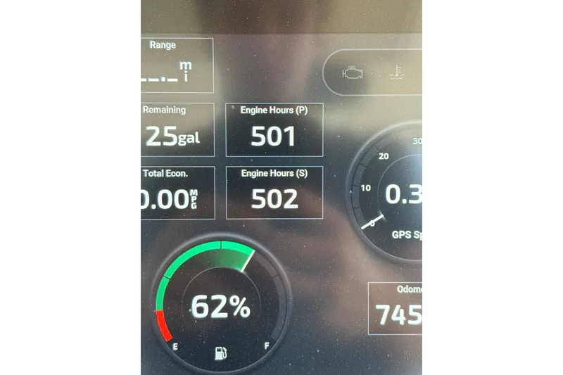 Slide: The Image of Dashboard display of a 2021 Scout 305 LXF showing fuel and engine data. - 40