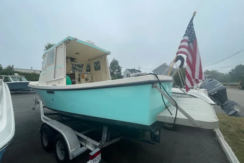 Slide: The Image of 1996 Rosborough Seaskiff 22 Wheelhouse Inboard on trailer with American flag. - 3