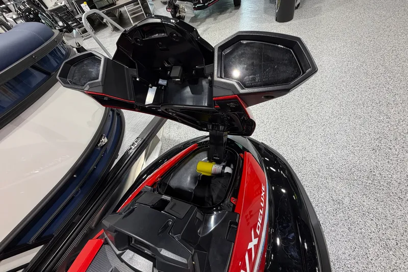 Slide: The Image of 2026 Yamaha WaveRunner VX Deluxe with open storage compartment in showroom. - 5